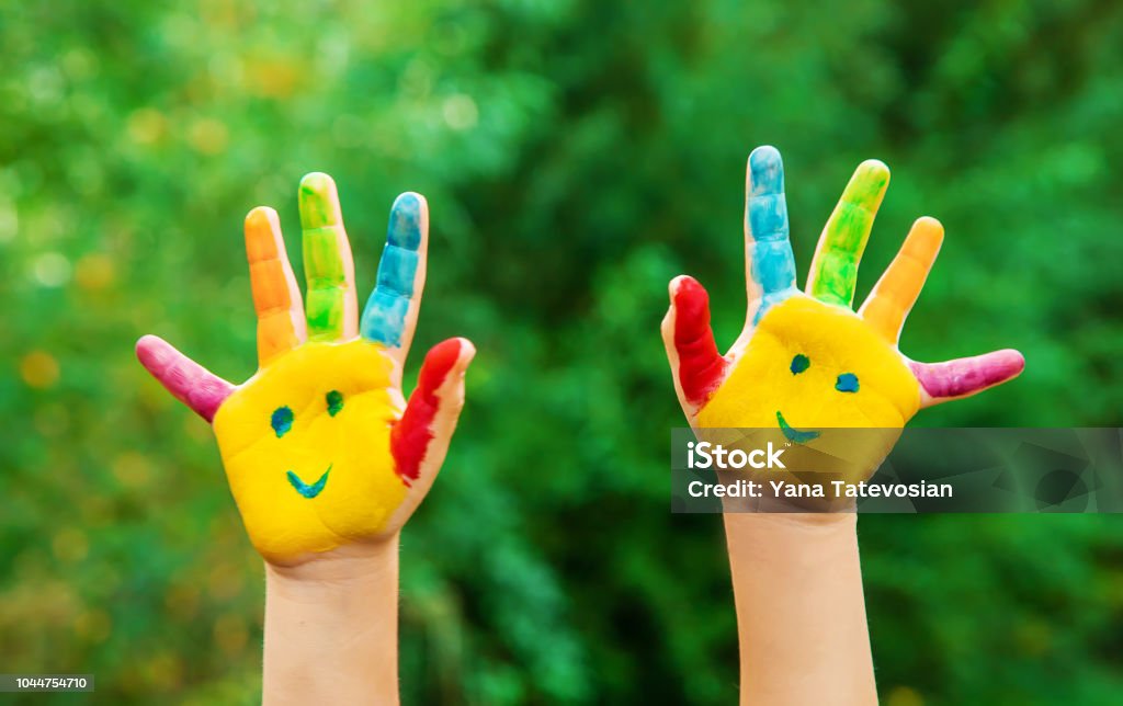 children hands in colors. Summer photo. Selective focus. children hands in colors. Summer photo. Selective focus. nature Preschool Stock Photo