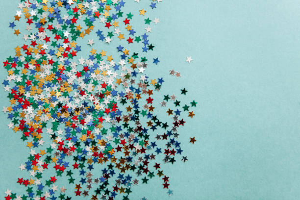 istock Festive background of multi-colored confetti stars 1044762604