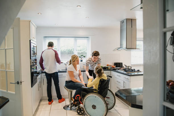 istock Family Life in the Kitchen with Disabled Daughter 1044764224