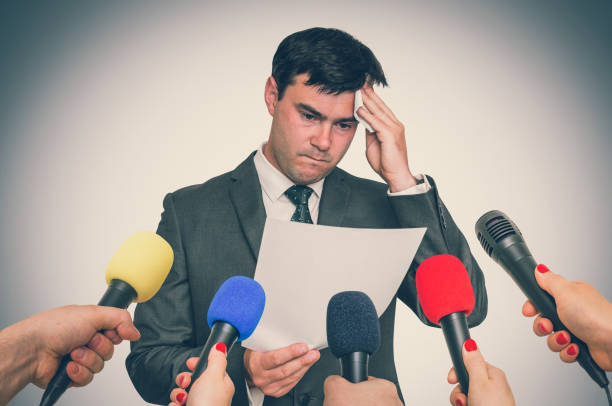 istock Nervous man is sweating, he afraid of public speech 1044768386