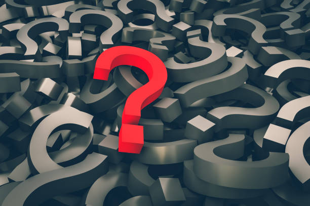 istock Red question mark on background of black question marks 1044769216