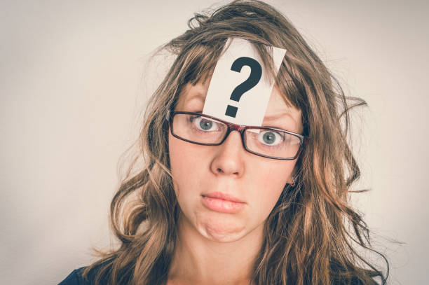 istock Woman with question mark on paper over her forehead 1044769516