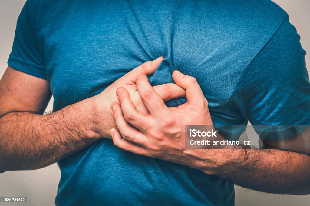 Man having chest pain, heart attack Man having chest pain, heart attack - body pain concept Heart Attack Stock Photo