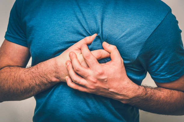 Man having chest pain, heart attack Man having chest pain, heart attack - body pain concept coronary artery photos stock pictures, royalty-free photos & images