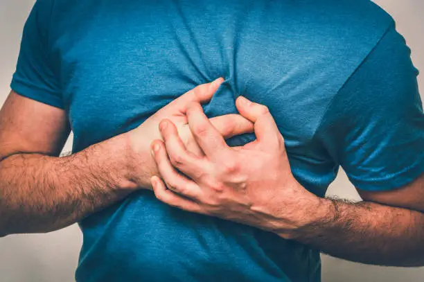 Man having chest pain, heart attack - body pain concept