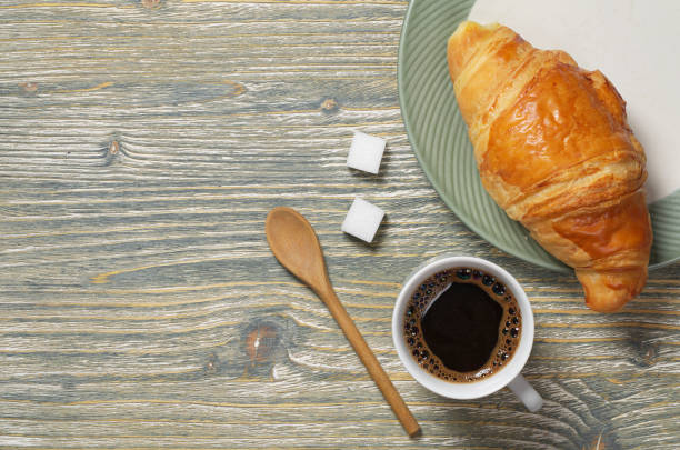 istock Coffee cup and croissant in plate 1044770622