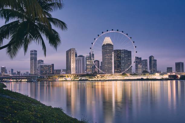 istock Singapore skyline at dusk 1044773344