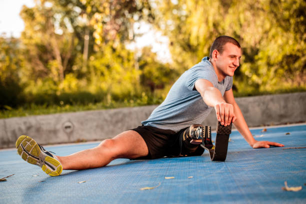 istock Disabled man stretching outdoors 1044774764