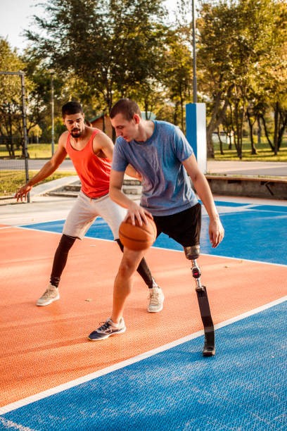 istock Friends playing basketball 1044774768