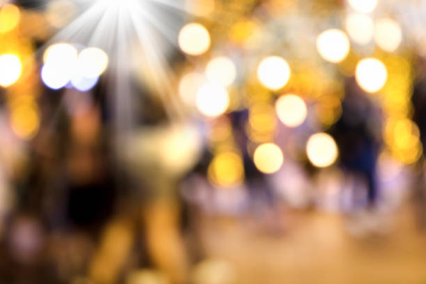 Conceptual abstract background image of defocused Christmas decoration on city street at night