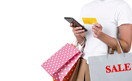 shopper using  mobile phone and credit card for making payment. black friday and shopping online concept isolated on white background.
