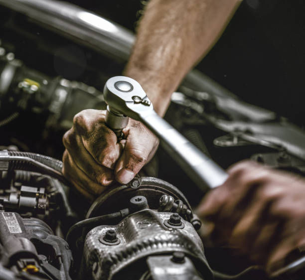 istock Auto mechanic working in garage. Repair service. 1044776260