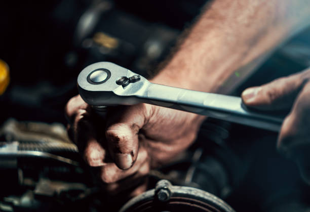 istock Auto mechanic working in garage. Repair service. 1044776396
