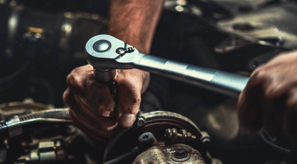 istock Auto mechanic working in garage. Repair service. 1044776416