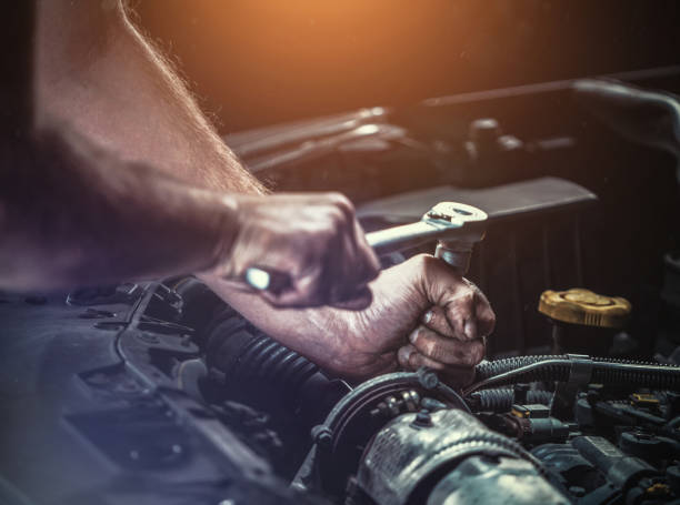 istock Auto mechanic working in garage. Repair service. 1044776436