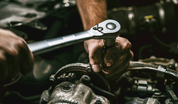 istock Auto mechanic working in garage. Repair service. 1044776440