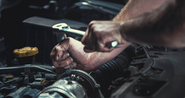 istock Auto mechanic working in garage. Repair service. 1044776448