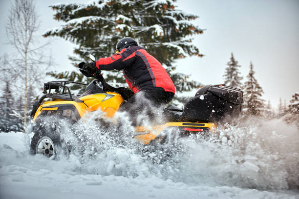 istock Winter race on an ATV on snow in the forest. 1044783682