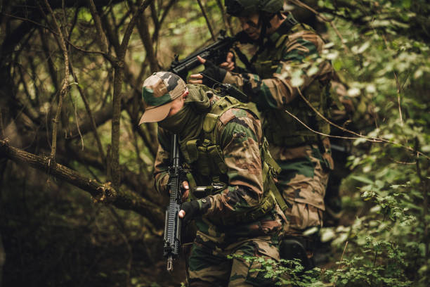 istock Military soldiers in forest 1044786386