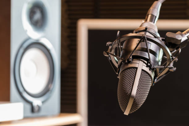 istock studio condenser microphone and loudspeakers monitor 1044786406