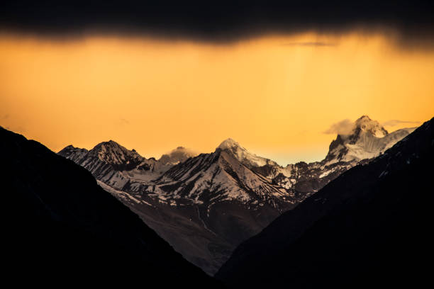 istock Sunset behind the peaks of himalayas 1044788670