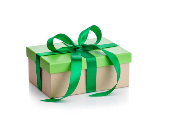 istock Brown and green gift box tied up with bow isolated on white 1044791390