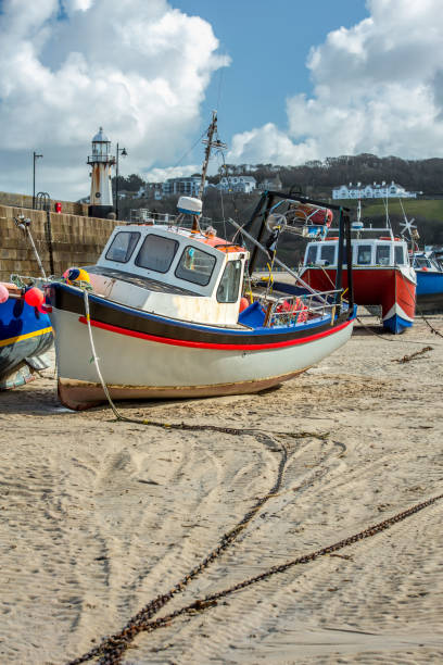 istock Fishing Boat, St Ives Harbour at low tide, Cornwall 1044795526