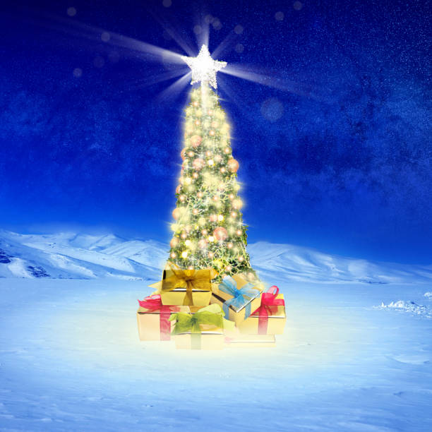 istock Decorated outdoor Christmas tree on snow covered landscape 1044804536