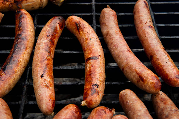 Sausages on grill stock photo