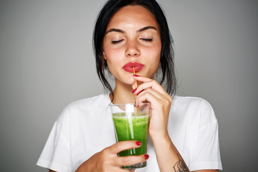 Young woman drink smoothie healthy detox