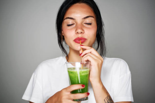 Young woman drink smoothie healthy detox Young woman drink smoothie healthy detox juice drink stock pictures, royalty-free photos & images
