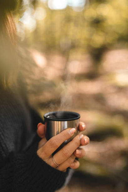 istock Woman picking mushrooms and drinking coffee in the forest 1044809070
