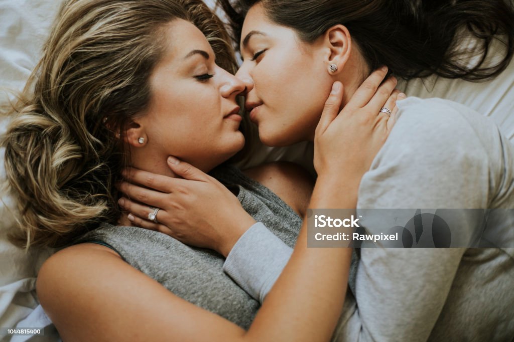 Lesbian couple kissing in the morning Lesbian Stock Photo