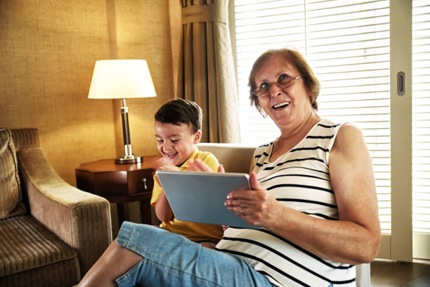 istock Grandmother and grandchild using digital tablet 1044815418