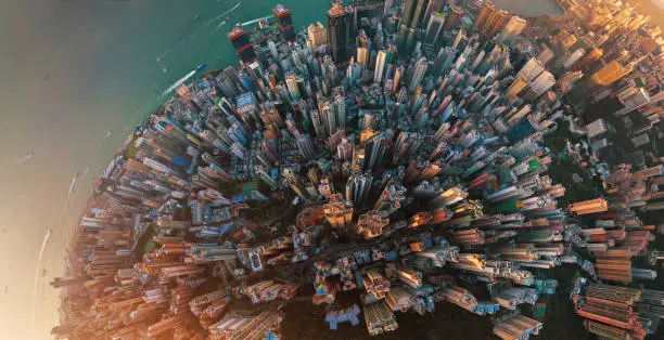 Photo of Little planet. Aerial view of Hong Kong Downtown. Financial district and business centers in smart city in Asia. Top view. Panorama of skyscraper and high-rise buildings.