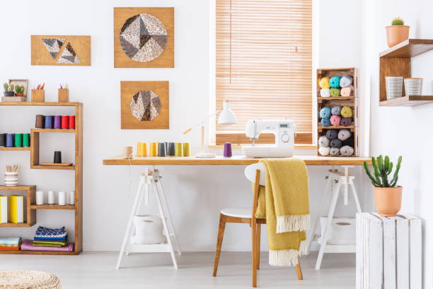 Real photo of a colorful room interior with a desk, sewing machine and threads Real photo of a colorful room interior with a desk, sewing machine and threads Crochet stock pictures, royalty-free photos & images