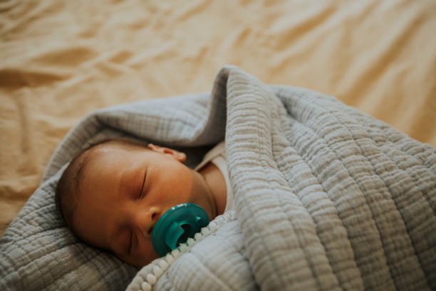 istock Infant baby fast asleep on the bed 1044817134