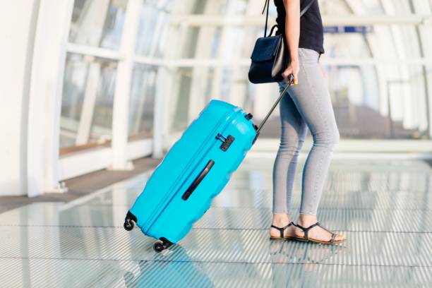 istock Woman with her bag on train station 1044820092