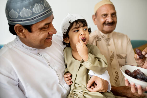 istock Muslim family having dried dates as a snack 1044820682