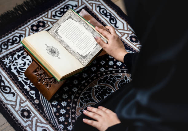 istock Muslim woman reading from the quran 1044820770