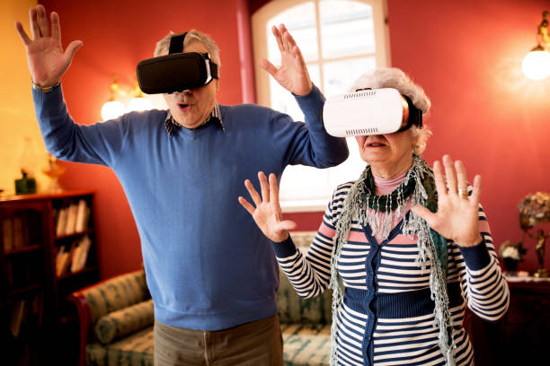 istock Funny shocked senior couple using virtual reality glasses 1044820982