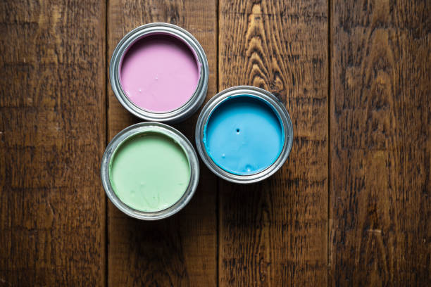 Cans of paint on wood
