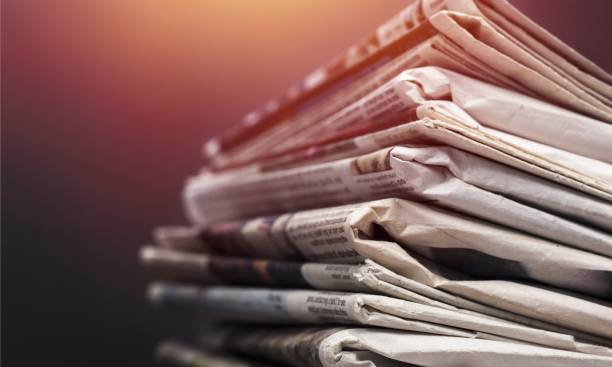 Journalism. Pile of newspapers on white background newspaper stock pictures, royalty-free photos & images