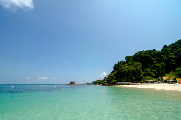 istock Beautiful tropical beach at sunny day with blue sky background 1044824172