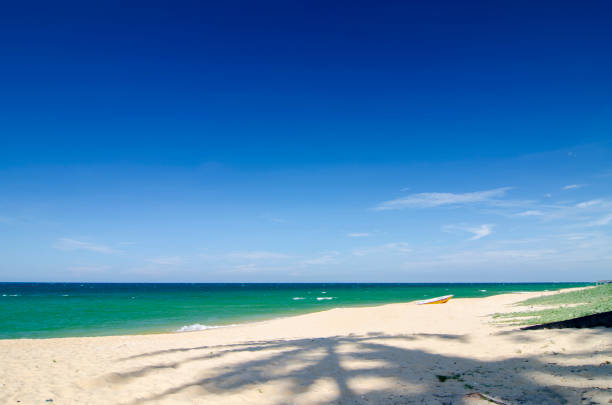 istock Beautiful tropical beach at sunny day with blue sky background 1044824178