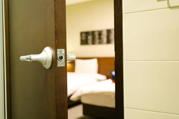 istock a half open door into bedroom interior as background 1044830134