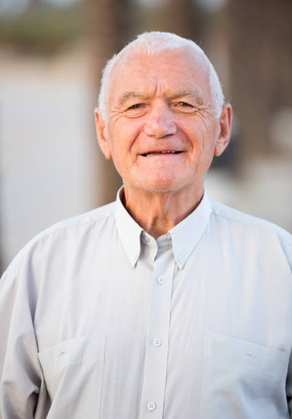 istock positive mature man in the park 1044832644