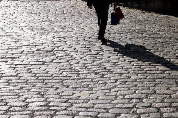 istock Walking along a cobblestone street. 1044834182