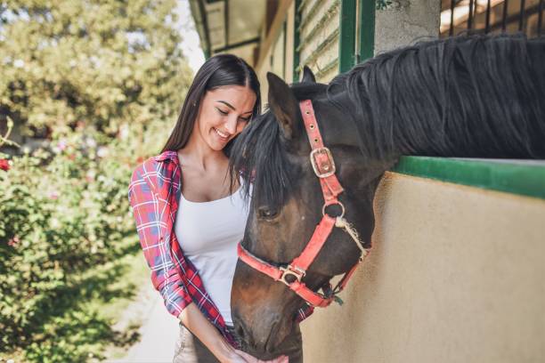 istock Young  woman with her horse 1044847784