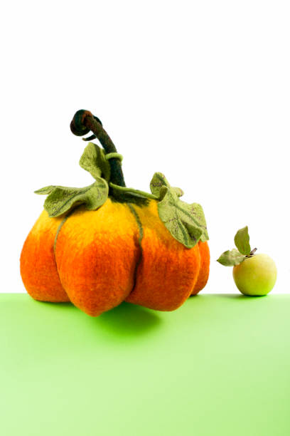 istock Pumpkin handmade from felted wool for celebration of Halloween 1044848068